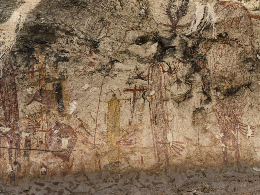 Black masked figure in Panther Cave