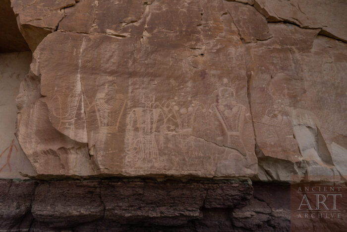 A part of the so called Head Hunter Panel at McConkie Ranch petroglyph site near Vernal, Utah. The panel is named for the recurring theme of large anthropmorphic figures holding severed heads.